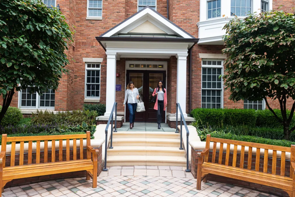 exterior image of residents walking out of the Esther Plaza 400 building
